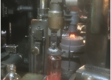 bottle-take-out-gripper-image-5 (1) PHD precision gripper installed by PSI Technologies for high-performance glass bottle takeout, delivering extended lifespan and reduced maintenance